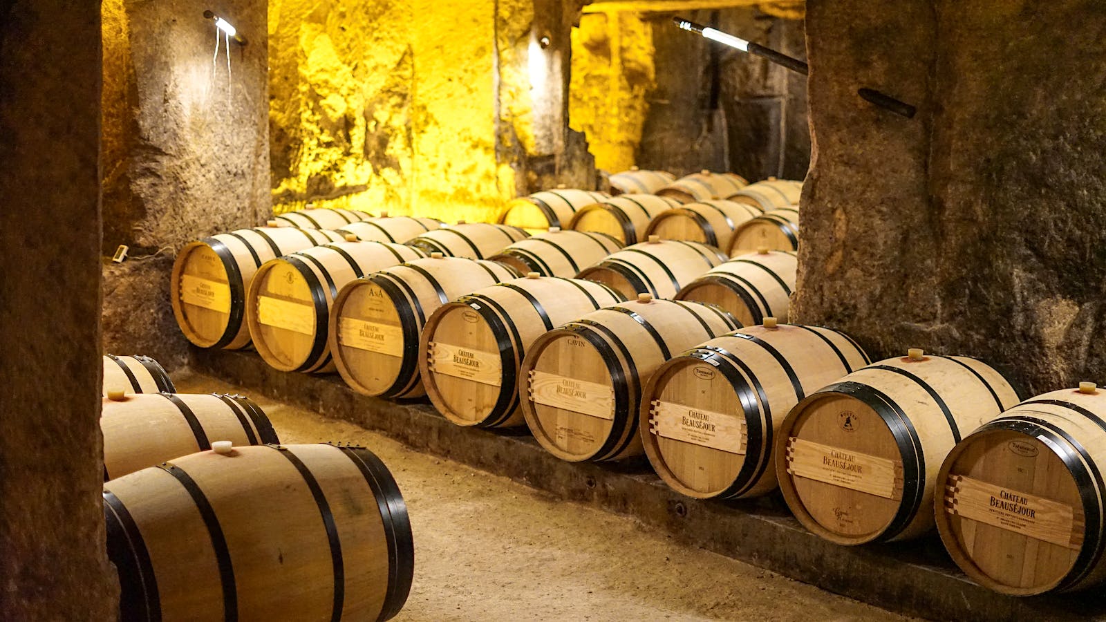 Château Beauséjour Duffau-Lagarrosse Bordeaux wine ages in barrel in the winery's quarry