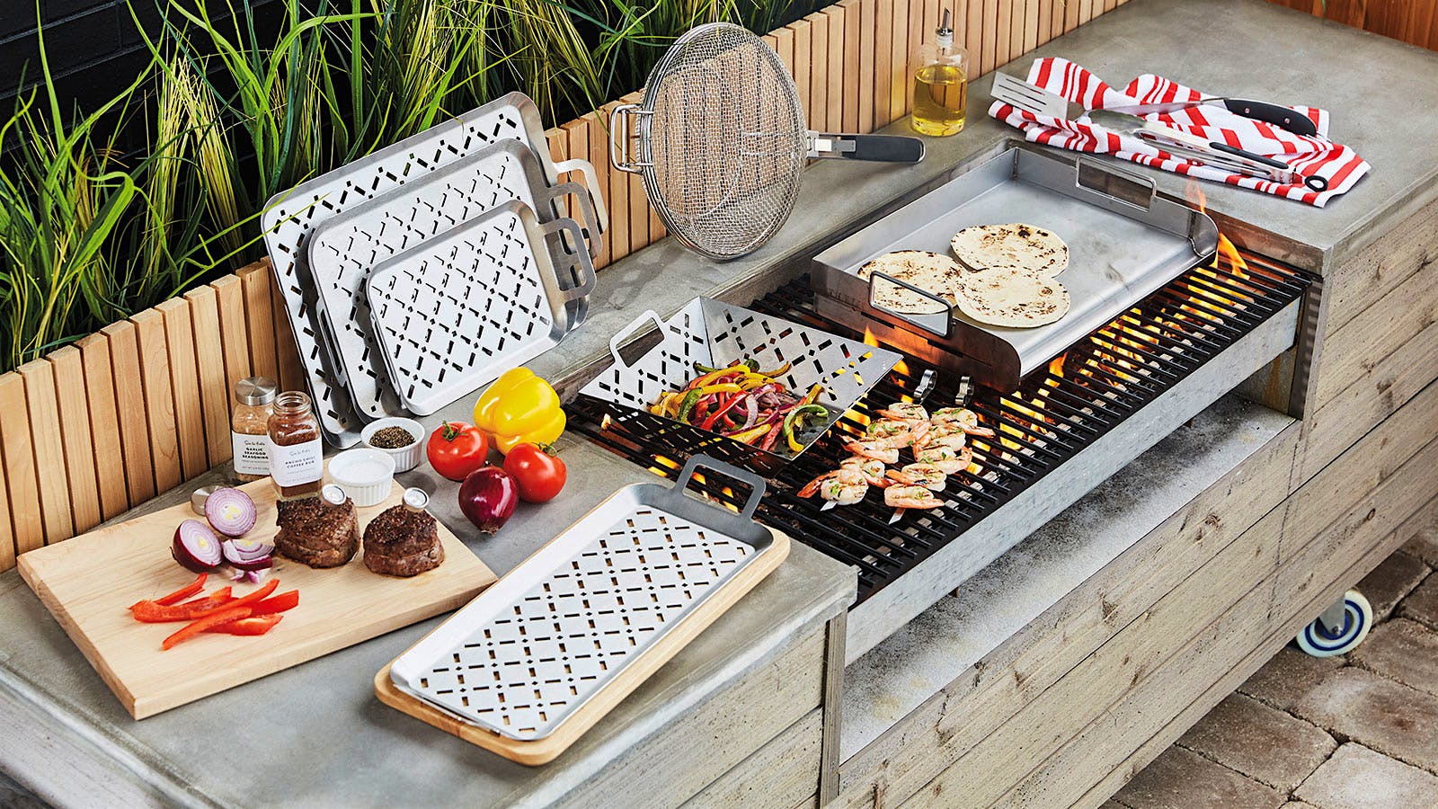 Stainless steel grill grids in use on an outdoor grill top.