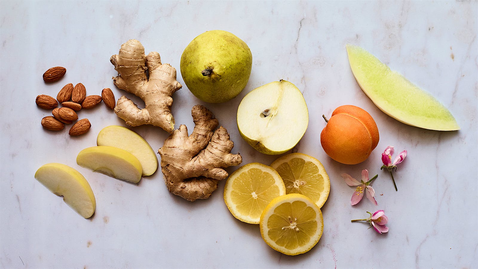 Almonds, yellow apple, ginger, pear, lemon, apricot, apple blossoms, melon