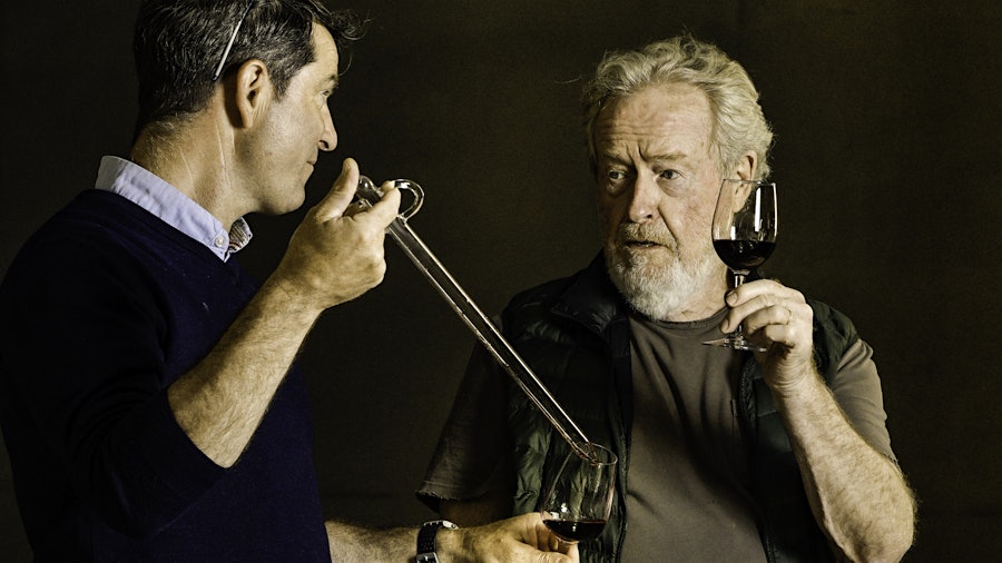 Filmmaker Ridley Scott (right) and Mas des Infermières estate director Christophe Barraud sample wine from barrel.