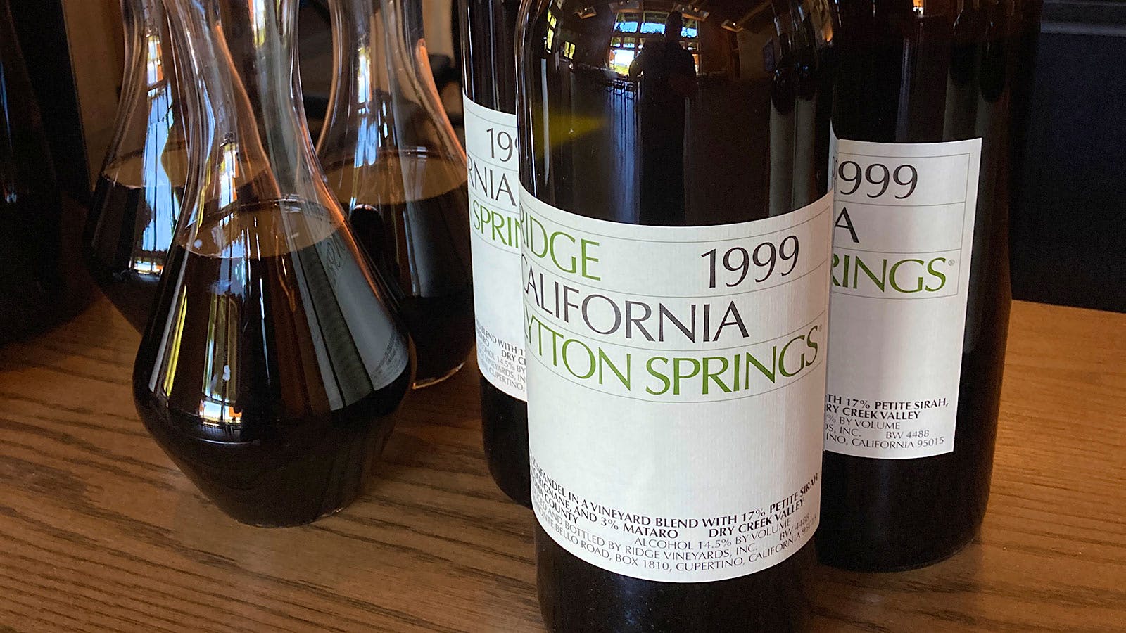 3 wine bottles and 3 decanters of Ridge Lytton Springs, a red Zinfandel blend from Sonoma County